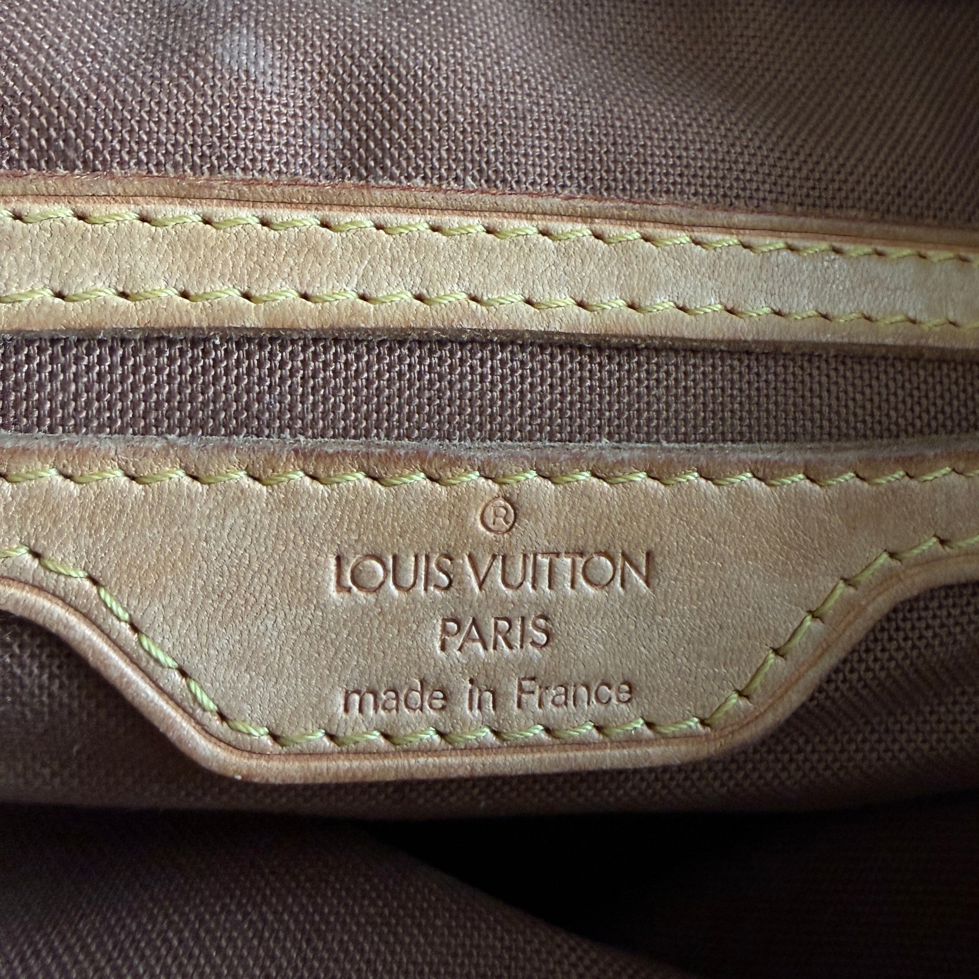 Close-up of a Louis Vuitton bag with visible branding.